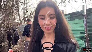 Girl in boots gets facial cumshot outdoors