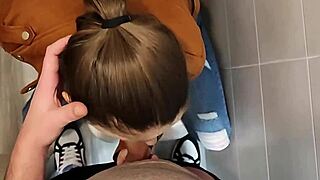 Blonde cougar sucks tits in university bathroom