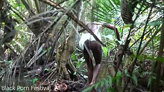 Skinny African woman works outdoors