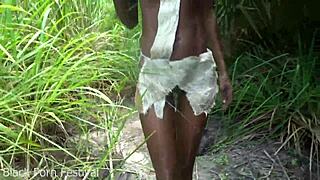 Skinny African woman works outdoors