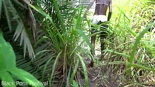 Skinny African woman works outdoors