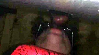 excited person performs deep action on large item through public hole in neutral setting