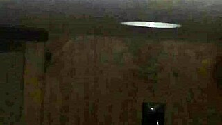 excited person performs deep action on large item through public hole in neutral setting