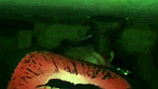 excited person performs deep action on large item through public hole in neutral setting