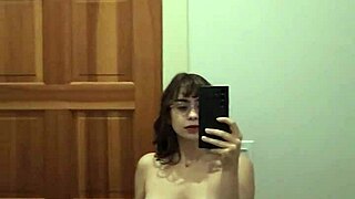 Teen amateur with small tits performs hot solo strip, showing shaved pussy and ass