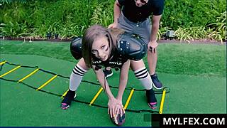 I see Britney Amber and Logan Pierce in an outdoor football scene