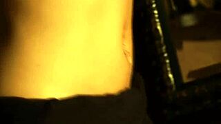 Brunette babe dances seductively, undressing to reveal her naked body in an erotic striptease.