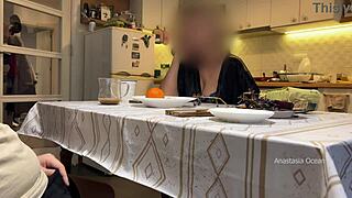 Husband jerking under table in front of step mom in kitchen