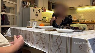Husband jerking under table in front of step mom in kitchen