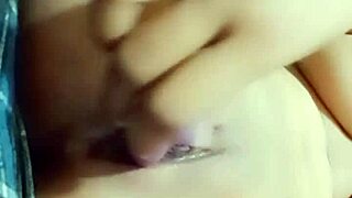 Beautiful Indian girl enjoys fingering her tight pussy at home