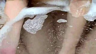In the pool, a sexy couple's handjob session leads to an intense underwater cumshot