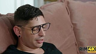 Blonde couple indulges in intense ass licking on the sofa