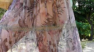 hairy mature woman in transparent dress flashing outdoors