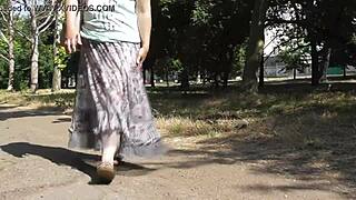 hairy mature woman in transparent dress flashing outdoors