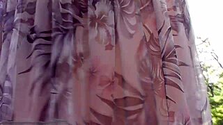 hairy mature woman in transparent dress flashing outdoors