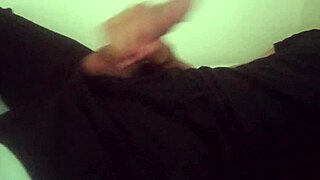 horny guy in black pants moans while jerking his big cock after work. he cums hard