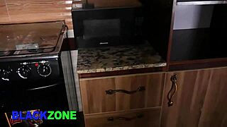 Curvy ebony stepmom fingers her belly in the kitchen