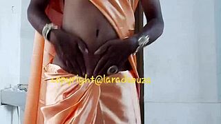lara dsouza as indian crossdresser in orange satin saree