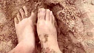 The bare feet gently play in the warm sand, creating a soothing sensory experience for the barefoot enthusiast.