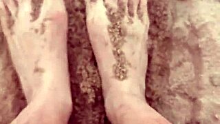 The bare feet gently play in the warm sand, creating a soothing sensory experience for the barefoot enthusiast.