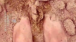 The bare feet gently play in the warm sand, creating a soothing sensory experience for the barefoot enthusiast.