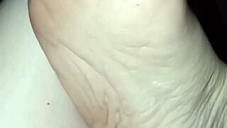 Barefoot slut's little foot explored in the dark