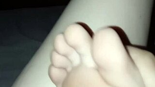 Barefoot slut's little foot explored in the dark