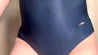 Feeling humiliated in the smelly school swimsuit covered in semen and urine, with a shiny anal plug inserted.