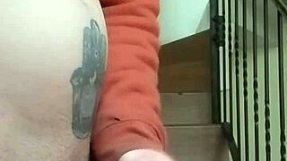 Masturbating on apartment stairs while neighbor talks on phone in garage