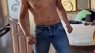 Naked bodybuilder prepares for voyeur fetish session at home