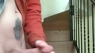 Masturbating on apartment stairs while neighbor talks on phone in garage