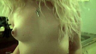 Curly blonde teases pretty pussy display in kitchen