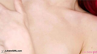 red haired model reveals her sexy body during photoshoot