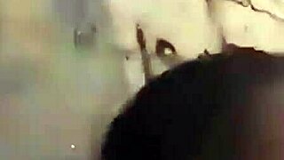 Two Liberian lesbians kiss and lick passionately in an uncompleted public building