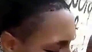 Two Liberian lesbians kiss and lick passionately in an uncompleted public building