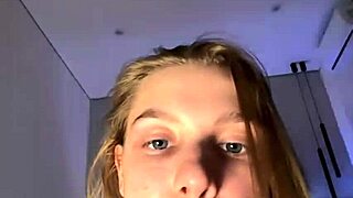 fingering a tight pink pussy on webcam, the young amateur teen orgasms hard from the hardcore masturbation.