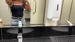 Brazilian Babe Masturbates In Public Bathroom