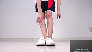 A woman applies lotion to her soles, moaning erotically