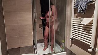 Big breasted MILF shaves her hairy pussy under the shower spray