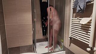 Big breasted MILF shaves her hairy pussy under the shower spray