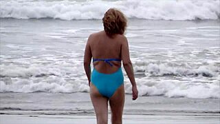 on the beach my wife strips naked and urinates looking for a man to fuck her