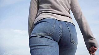 milf walking outdoors in loose jeans with her phat ass