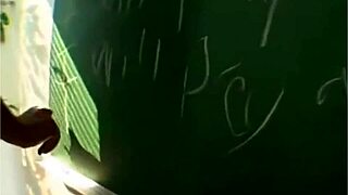 The teacher patiently teaches the student an important lesson in the classroom