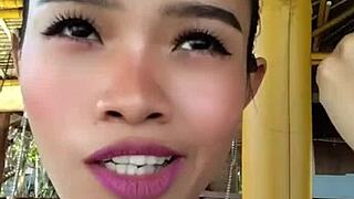 Beauty gives speech and shows off huge dildo.