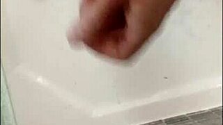 Blonde Blue-Eyed Bodybuilder Showers Muscular Body While Stroking Huge Cock