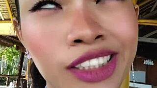 Beauty gives speech and shows off huge dildo.