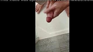 Blonde Blue-Eyed Bodybuilder Showers Muscular Body While Stroking Huge Cock