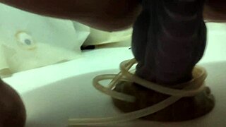 In the shower, an amateur explores the extra large Apollo Bad Dragon dildo.