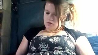 She masturbates in a dress, using toys for pleasure.