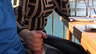 yo, watch this milf jerk off a huge cock in a restaurant!